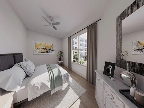 a bedroom with a bed and a ceiling fan